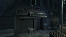 LED 띠로 장식된 간판이 있는 야간의 Variety Shop.