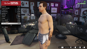 Bikers-GTAO-MaleTattoos-LeftArm2-MufflerHelmet.png