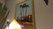 벽에 걸린 "R North"라고 적힌 그림, 락스타 노스에 대한 오마주.