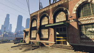DarnellBrosGarmentFactory-GTAVe-Torched-Closeup.png