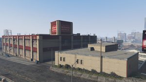 MaibatsuFactory-GTAV-SupplyStreetFromNortheast.png