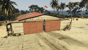 CayoPerico-GTAO-HangarExterior.png