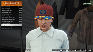 ImportExport-GTAO-FemaleHats-Caps14-OrangeCamoSandCastleCap.png