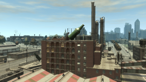 Sprunk-GTAIV-AlderneyFactory-AerialView.png